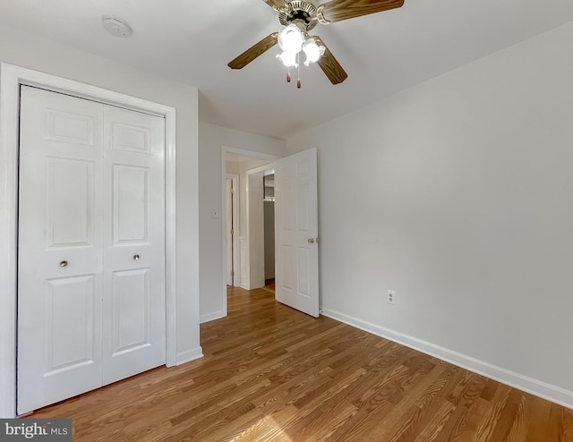 42190 Ridge Rd, Mechanicsville, MD 20659 - unfurnished bedroom featuring baseboards, ceiling fan, light wood-style flooring, and a closet