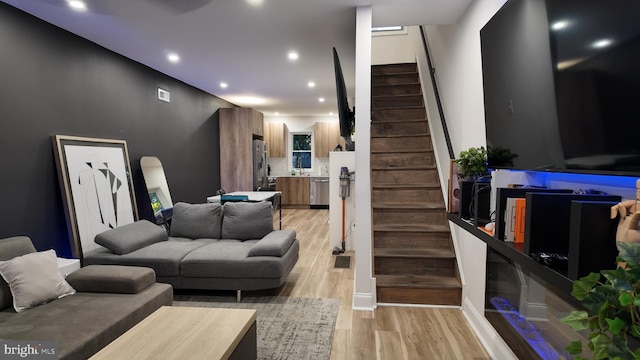 2246 N Hancock St, Philadelphia, PA 19133 - living area with stairs, recessed lighting, arched walkways, and light wood-style floors