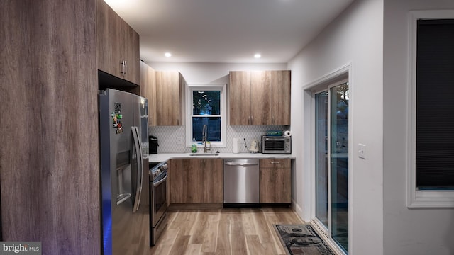 2246 N Hancock St, Philadelphia, PA 19133 - kitchen featuring stainless steel appliances, a sink, and modern cabinets