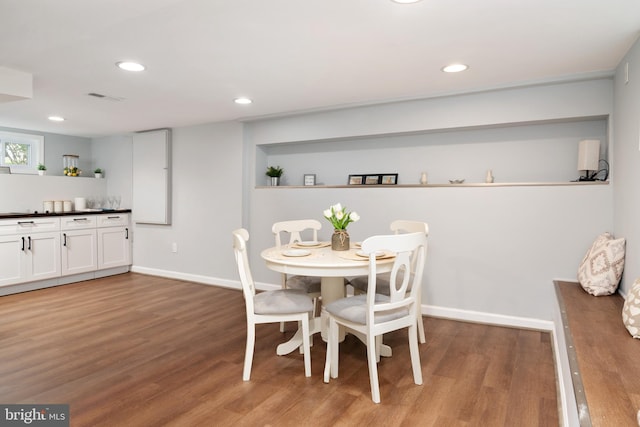 1119 Overbrook Rd, Baltimore, MD 21239 - dining area with wood finished floors, recessed lighting, and baseboards