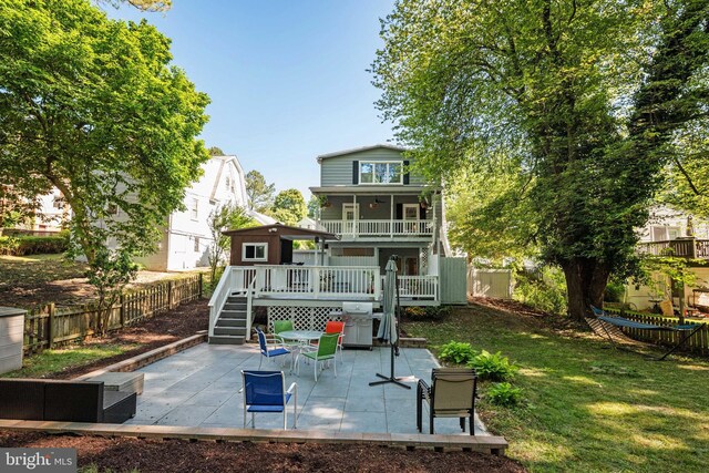 1119 Overbrook Rd, Baltimore, MD 21239 - back of house with stairway, a patio, and a wooden deck