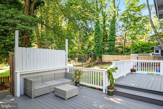 1119 Overbrook Rd, Baltimore, MD 21239 - wooden terrace with a playground, a fenced backyard, view of scattered trees, and an outdoor hangout area