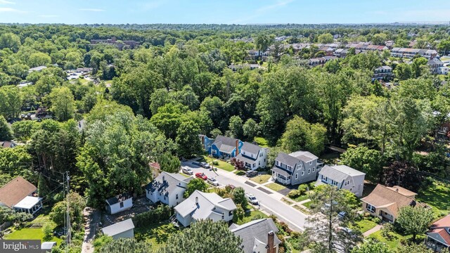 1119 Overbrook Rd, Baltimore, MD 21239 - aerial perspective of suburban area featuring a heavily wooded area
