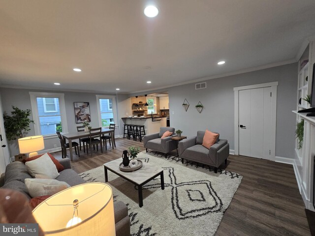1119 Overbrook Rd, Baltimore, MD 21239 - living room featuring recessed lighting, ornamental molding, dark wood-type flooring, and baseboards