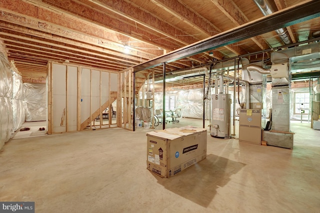 basement featuring water heater and heating unit