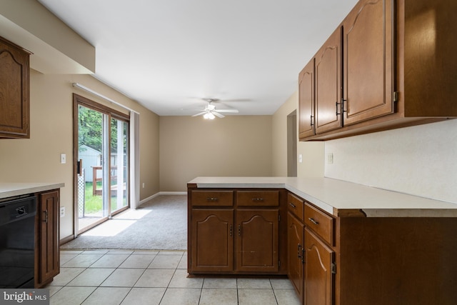 kitchen with a ceiling fan, dishwasher, light countertops, a peninsula, and light carpet