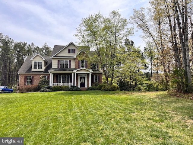 168 Thomas Dr, Middletown, VA 22645 - view of front facade featuring a porch, a front lawn, and brick siding