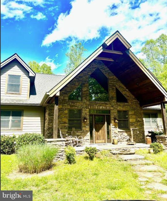view of front of property with stone siding