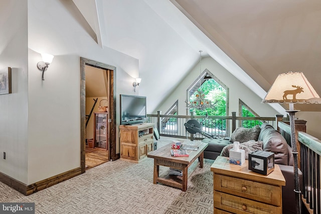 living room featuring carpet, baseboards, and lofted ceiling