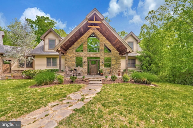 view of front of house with stone siding and a front lawn