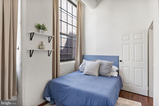 bedroom with wood finished floors