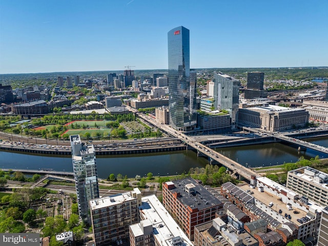 view of urban area featuring a notable bridge and a nearby body of water
