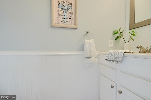 bathroom featuring wainscoting and vanity