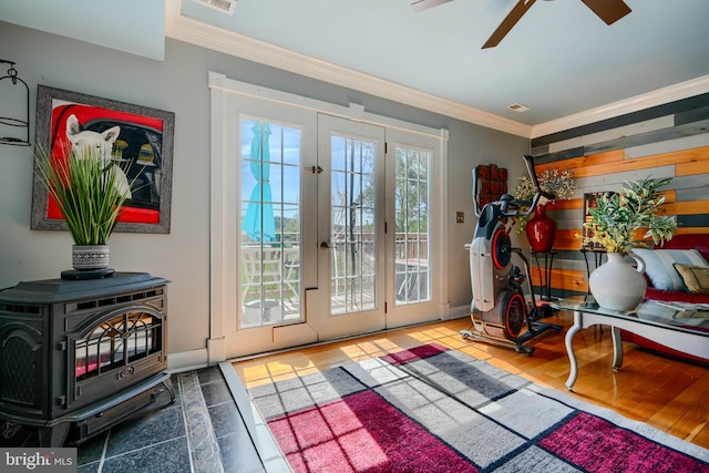doorway to outside with visible vents, ornamental molding, baseboards, french doors, and a ceiling fan