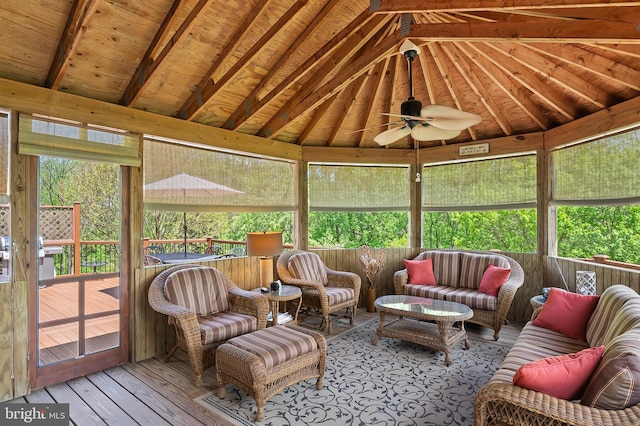 sunroom featuring ceiling fan, an outdoor living space, and a wealth of natural light