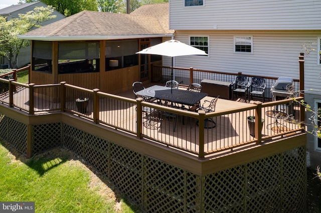 deck with a sunroom, a grill, and outdoor dining space