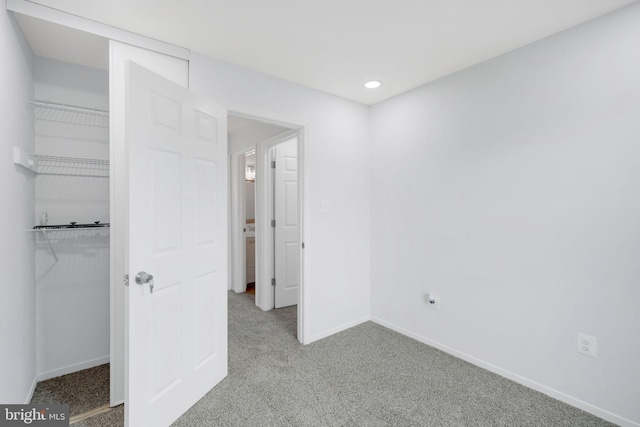 34 Starboard Ct, Gaithersburg, MD 20877 - unfurnished bedroom with light colored carpet, baseboards, a walk in closet, a closet, and recessed lighting