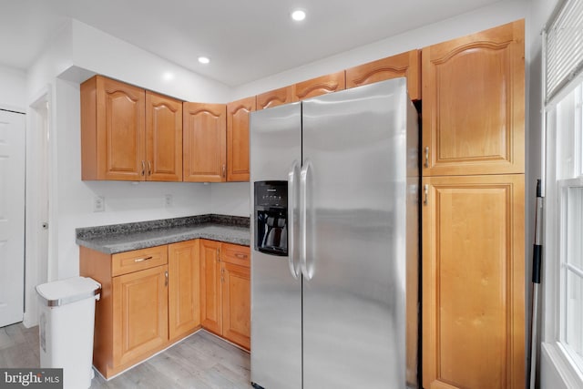 34 Starboard Ct, Gaithersburg, MD 20877 - kitchen with stainless steel refrigerator with ice dispenser, light wood-type flooring, dark countertops, and recessed lighting