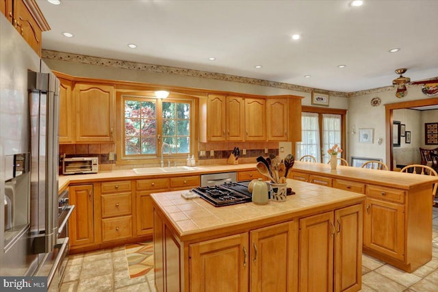 3401 Eisenbrown Rd, Reading, PA 19605 - kitchen featuring a kitchen island, a sink, tile counters, stainless steel appliances, and recessed lighting