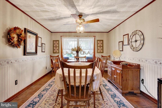 3401 Eisenbrown Rd, Reading, PA 19605 - dining room featuring a wainscoted wall, ceiling fan, and ornamental molding