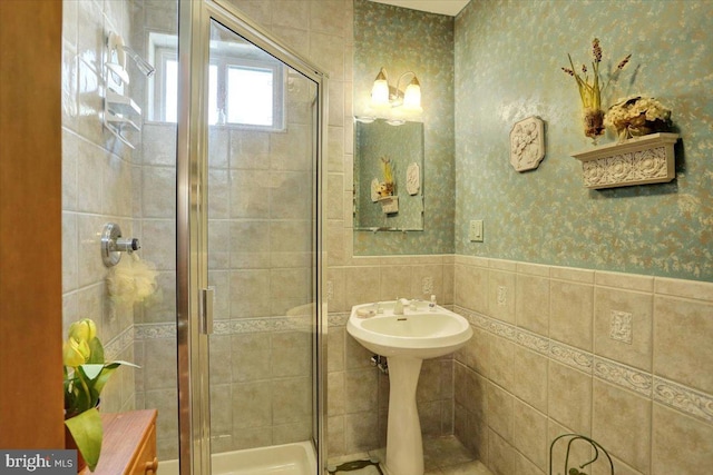 3401 Eisenbrown Rd, Reading, PA 19605 - bathroom featuring a wainscoted wall, a shower stall, tile walls, and wallpapered walls