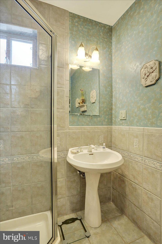 3401 Eisenbrown Rd, Reading, PA 19605 - bathroom with wallpapered walls, tile walls, tile patterned flooring, and a stall shower