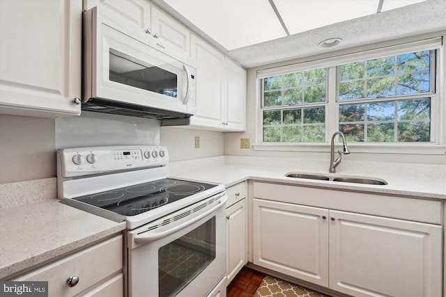 12116 Greenway Ct Unit 302, Fairfax, VA 22033 - kitchen with a sink, white cabinets, and white appliances