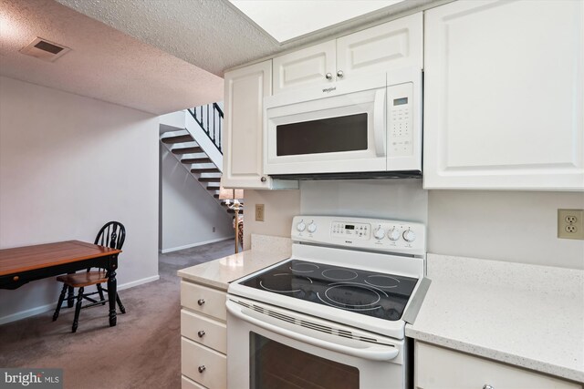 12116 Greenway Ct Unit 302, Fairfax, VA 22033 - kitchen featuring white cabinets, white appliances, a textured ceiling, carpet, and baseboards