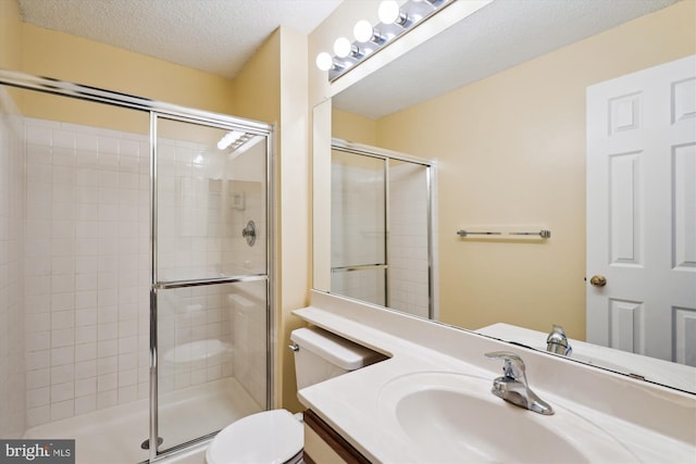 12116 Greenway Ct Unit 302, Fairfax, VA 22033 - full bathroom featuring vanity, toilet, a textured ceiling, and a stall shower