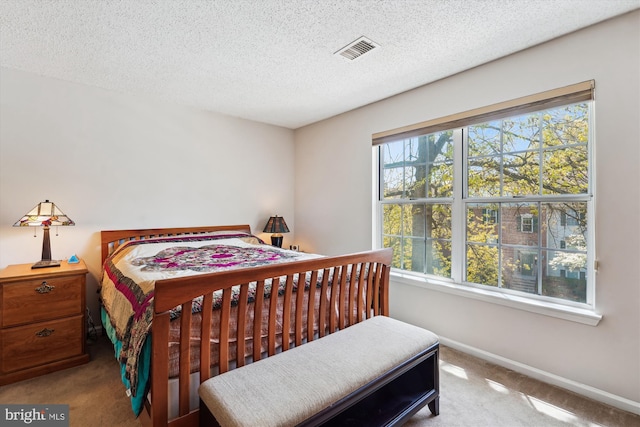 12116 Greenway Ct Unit 302, Fairfax, VA 22033 - carpeted bedroom featuring visible vents, a textured ceiling, and baseboards