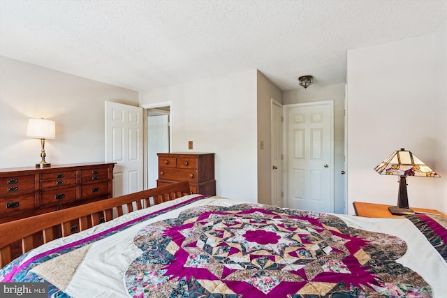 12116 Greenway Ct Unit 302, Fairfax, VA 22033 - bedroom with a textured ceiling