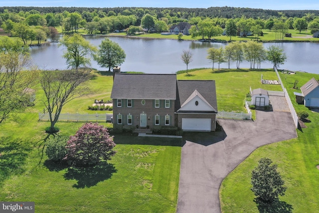 birds eye view of property featuring a water view