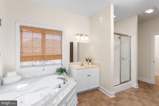 full bath featuring vanity, a whirlpool tub, baseboards, and a stall shower