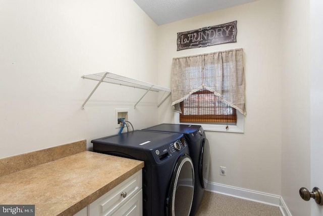 clothes washing area featuring laundry area, baseboards, and washer and dryer