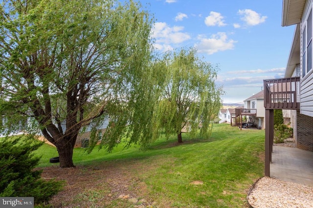 view of yard with a wooden deck