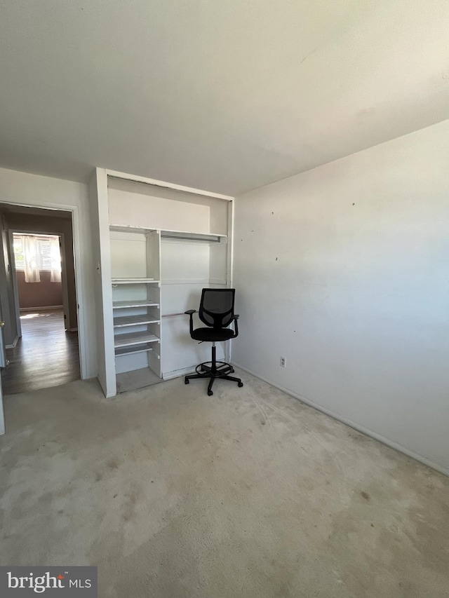 unfurnished office with carpet flooring