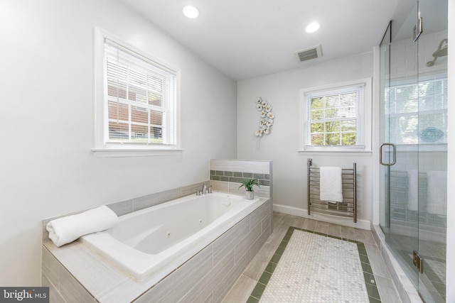 bathroom with tile patterned flooring, recessed lighting, a tub with jets, a shower stall, and visible vents