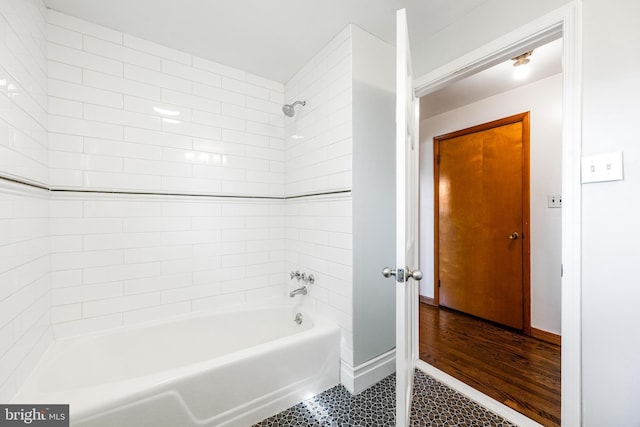 bathroom featuring shower / bathing tub combination and tile patterned flooring