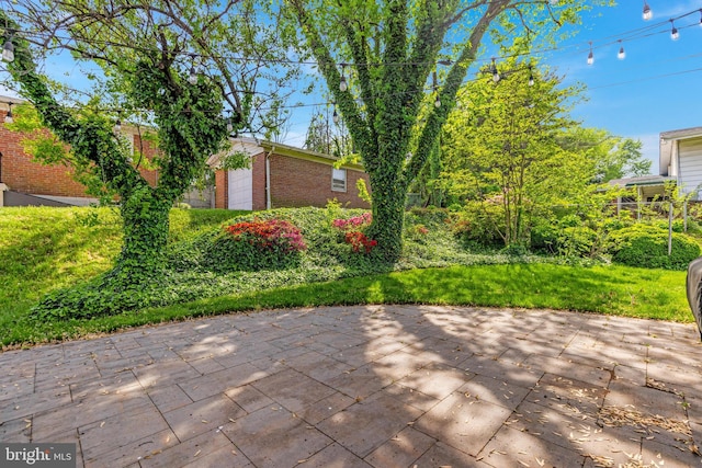 view of patio / terrace featuring an attached garage