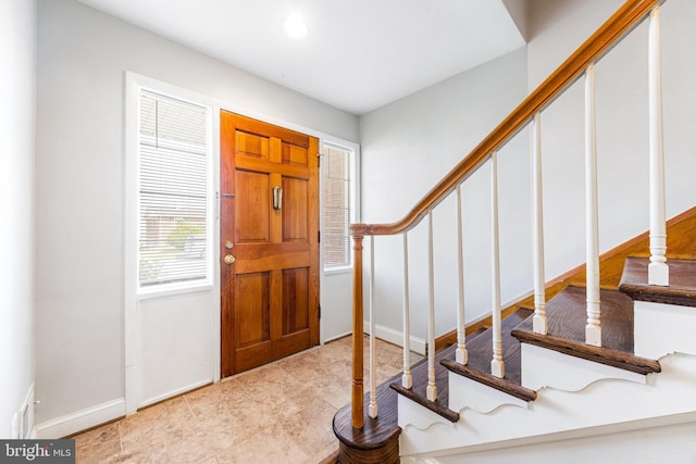 entrance foyer featuring recessed lighting and stairway