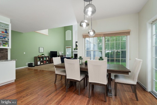 3 Firestone Ct, Skillman, NJ 08558 - dining space featuring a fireplace, wood finished floors, and baseboards