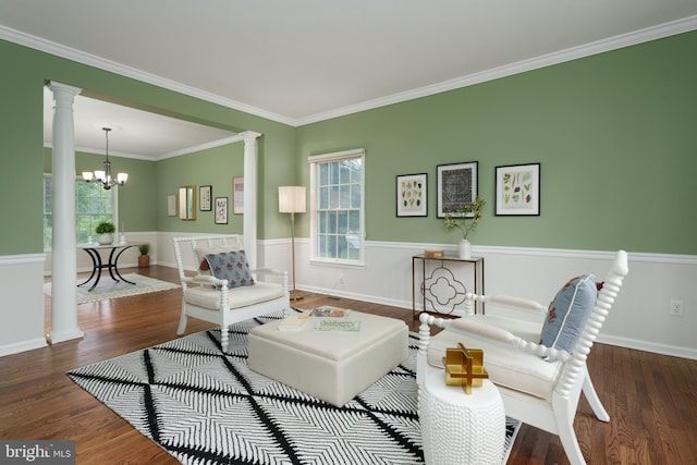 3 Firestone Ct, Skillman, NJ 08558 - living area with decorative columns, a chandelier, wood finished floors, crown molding, and baseboards