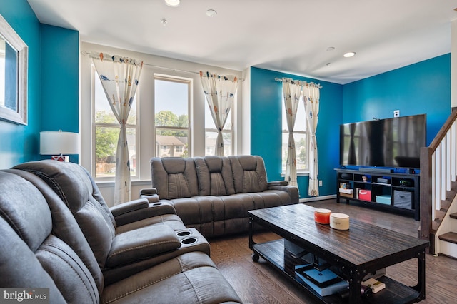 living room featuring stairway, recessed lighting, wood finished floors, and a wealth of natural light