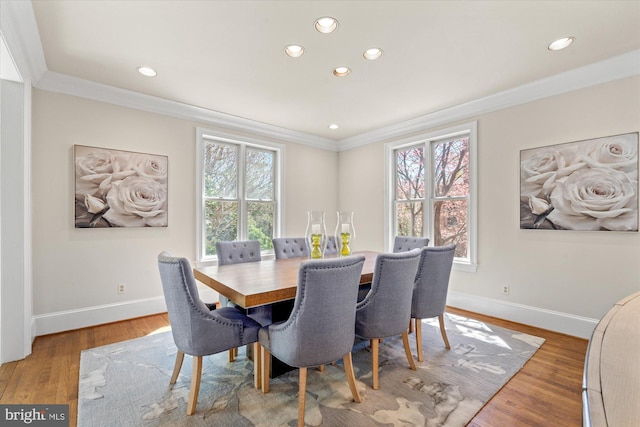 dining area with baseboards, ornamental molding, recessed lighting, and wood finished floors