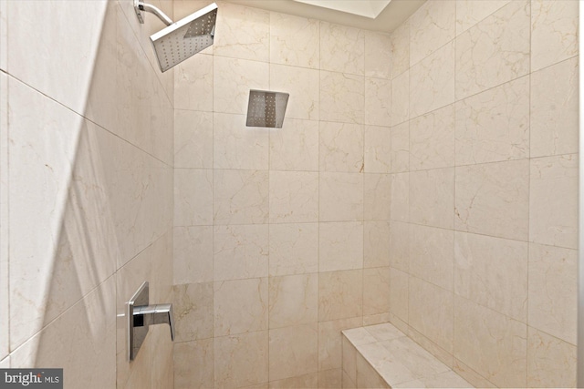 bathroom featuring tiled shower