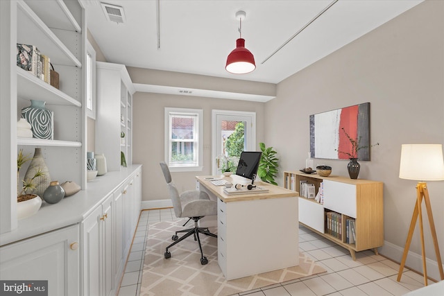 home office featuring visible vents, baseboards, and light tile patterned floors