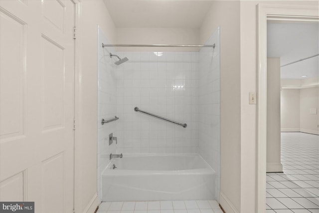 bathroom with baseboards and tile patterned floors