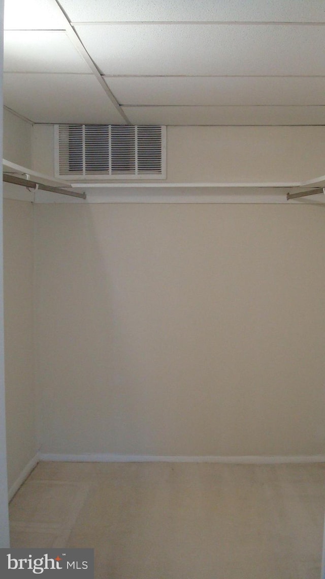 spacious closet featuring visible vents