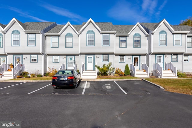 multi unit property featuring uncovered parking