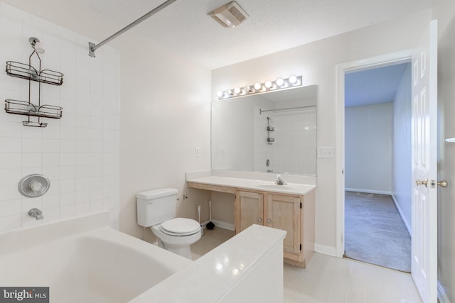 full bathroom featuring tile patterned flooring, vanity, tub / shower combination, toilet, and baseboards